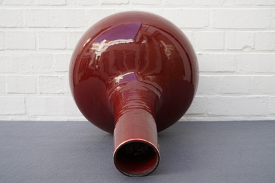 Three Chinese sang-de-boeuf-glazed bottle vases, 20th C.